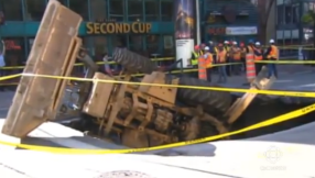 Sinkhole: Montreal street swallows backhoe [VIDEO, PHOTOS]: Sewer pipe leak blamed