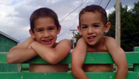 Python kills two boys sleeping (VIDEO): 14 foot African rock python slithered up ventilation duct of pet shop, fell through ceiling into home