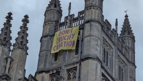 Christian climate protesters charged over banner drop from Bath Abbey
