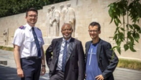 Markus Hofer, Joseph Kabongo and Michael Mutzner in front of the Reformation Wall in Geneva. Magali Girardin