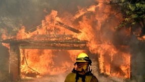 Southern California residents evacuate as fast-moving wildfire rages