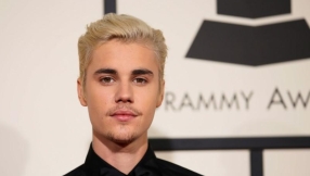 Justin Bieber news: Pop star takes injured mother to church on a wheelchair