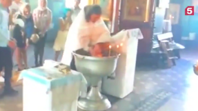 Priest suspended after rough baptism that left baby terrified
