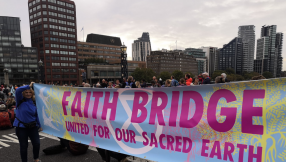 Christians holding baptisms and Eucharist on London bridge as part of Extinction Rebellion
