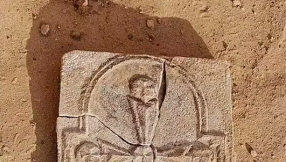 Archaeologists uncover ancient cross that shows Christianity once thrived in Arabian Gulf
