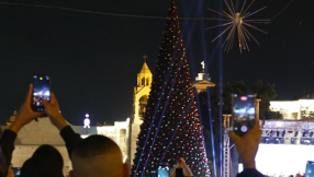 'Light of hope for us': Christmas lights illuminate Bethlehem and Jerusalem for the first time in two years