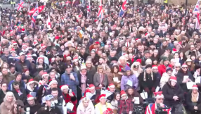Large crowds join Tommy Robinson's Christmas carol service