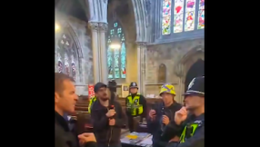 Apology issued after anti-immigration protesters confront clergyman inside church