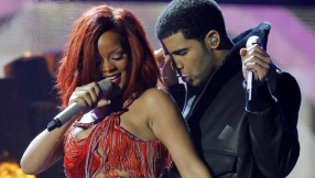Drake projects \'666\' and Rihanna\'s face during Toronto concert