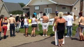 Strippers and church members clash on camera after nine-year feud