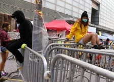 Hong Kong: Pro-democracy protestors vow to continue as camp is partially cleared