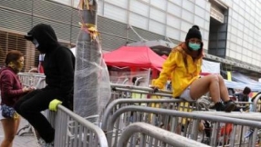 Hong Kong: Pro-democracy protestors vow to continue as camp is partially cleared