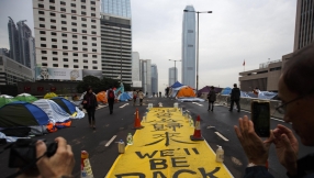 Hong Kong protesters stand firm in final hours before police clearance