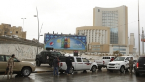 Libya: Eight dead as gunmen storm luxury hotel