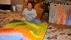 Blind painter raises over $1 million for charity