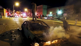 Baltimore erupts in riots after funeral of black man who died in police custody