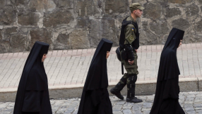 \'It\'s a sign from God\': Mary and Jesus  stains on windowpane leave Ukrainians in awe
