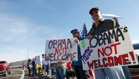 \'Go away\' signs greet President Obama in Oregon as he pursues gun control agenda