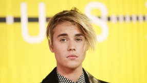 Justin Bieber apologises for storming off stage when unruly fans tried to grab him