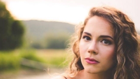 Catholic singer says her songs seek to open people\'s hearts to God, but she doesn\'t want \'Christian\' label