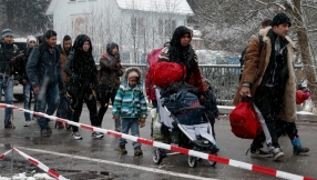 Austria says refugee flow to be slowed \'step by step\'