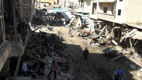 Syrian talks appear doomed as air strike kills dozens in market