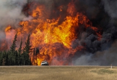 Canada wildfire: Evacuees gather to pray as fire rages on