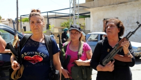 \'We will send jihadists straight to hell\': Lebanese Christian women take up arms after deadly suicide bombings