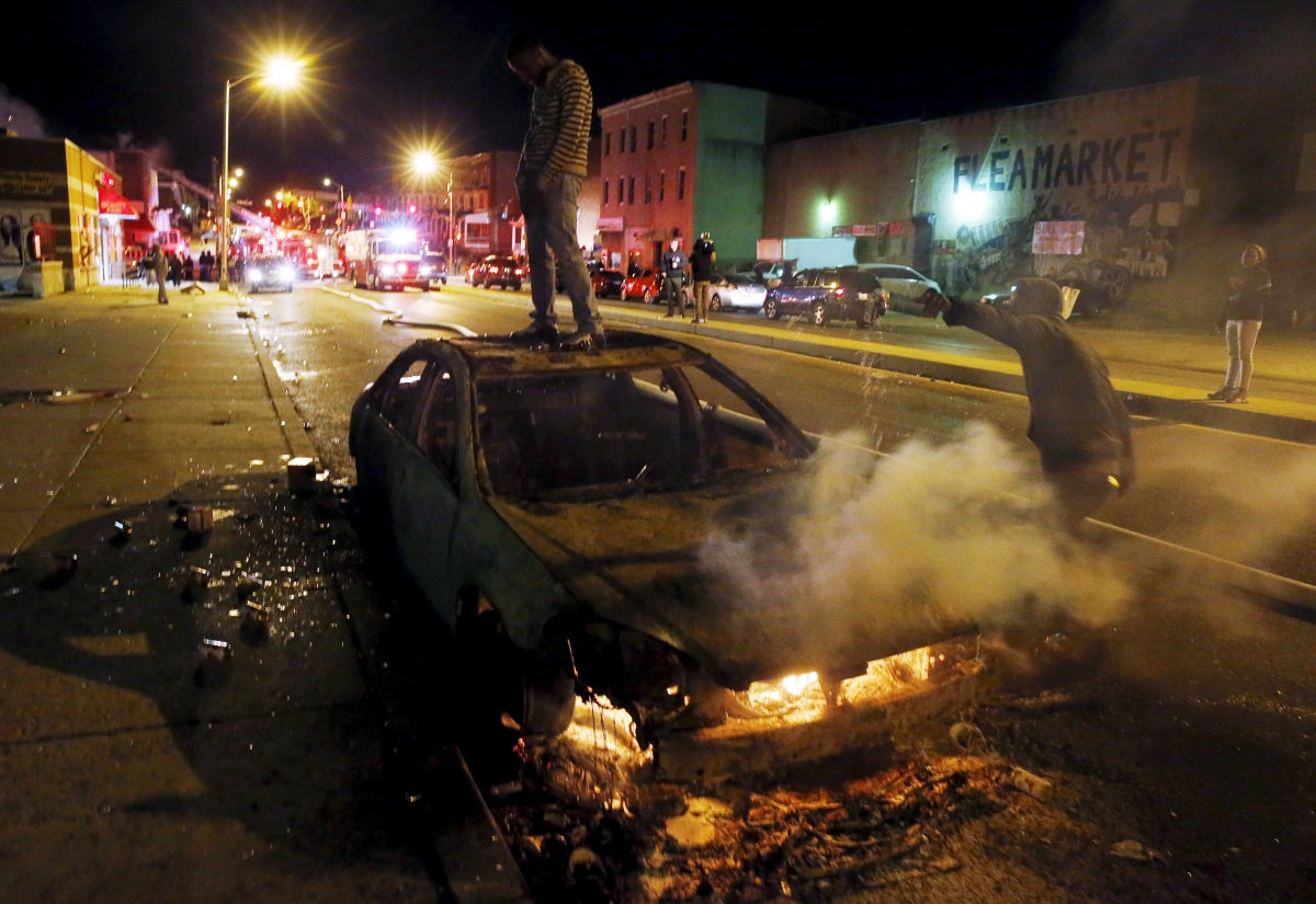 Baltimore erupts in riots after funeral of black man who died in police ...