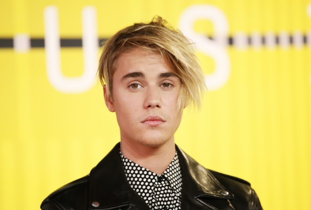 Justin Bieber apologises for storming off stage when unruly fans tried