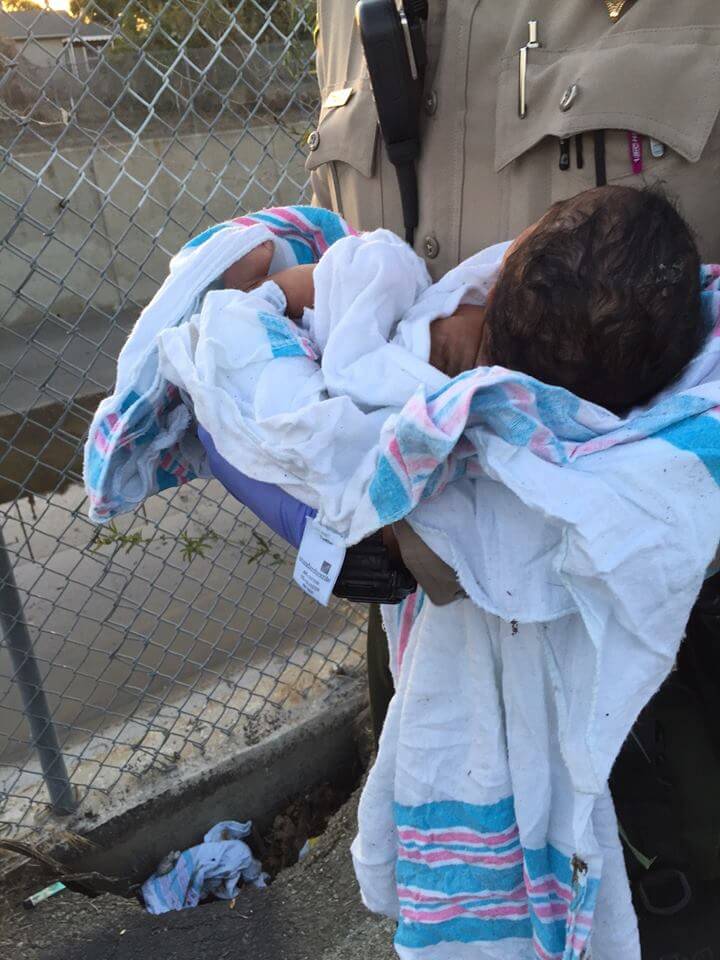 Newborn baby wrapped in blanket found buried alive under asphalt ...